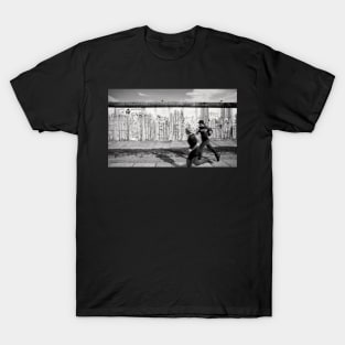 Two kids running along the remains of the Berlin Wall, Berlin, Germany T-Shirt